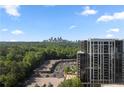 Expansive view from a residential high rise showing the city skyline in the distance at 2479 Peachtree Ne Rd # 1801, Atlanta, GA 30305