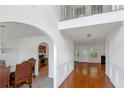 Bright foyer with hardwood floors, arched entryway, and view to the living room at 11354 Conner Ct, Hampton, GA 30228