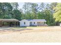 Inviting single-story home featuring a lovely front porch and well-maintained lawn at 1508 Franklin Cir, Dacula, GA 30019