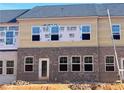 New construction townhome featuring a brick facade and lots of windows at 3106 Marbella Cir # 3, Kennesaw, GA 30152