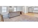 Large living room featuring carpet, fireplace, and entry to a kitchen at 392 Vine St, Atlanta, GA 30314