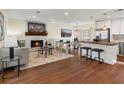 Spacious living area showcases a fireplace, modern seating, and an open flow to the kitchen at 6974 Clearlake Ct, Peachtree Corners, GA 30360