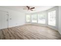 Open floor plan with stylish flooring, modern ceiling fan, and bright natural light at 1306 Red Deer Way # 246, Alpharetta, GA 30022