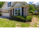 Attractive single-Gathering home with brick and siding, enhanced by neat landscaping at 10110 Malcolm Ct, Covington, GA 30014