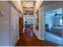 Welcoming foyer with high ceilings and hardwood floors leading into the home at 10110 Malcolm Ct, Covington, GA 30014