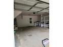 Spacious two car garage with ample storage space and a functional work area at 2320 Glynmoore Dr, Lawrenceville, GA 30043