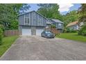 Charming two-story home featuring a two-car garage and extra-wide driveway at 2673 Deerfield Sw Cir, Marietta, GA 30064