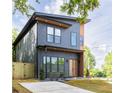 Contemporary two-story home featuring a modern exterior and neatly landscaped front yard at 104 Meldon Ave, Atlanta, GA 30315