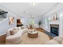 Bright living room with a cozy fireplace and stylish decor for comfortable living at 740 Marcus Nyah Ct, Atlanta, GA 30349