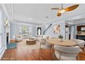 Bright, airy living room with hardwood floors, fireplace, and ample natural light at 740 Marcus Nyah Ct, Atlanta, GA 30349