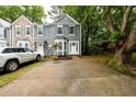 Two-story townhome with ample parking, attractive siding, and mature trees at 3001 Majestic Park Ct, Duluth, GA 30096