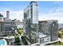 Modern high-rise building with glass facade showcasing its contemporary design against a vibrant city skyline at 45 Ivan Allen Jr Nw Blvd # 1702, Atlanta, GA 30308