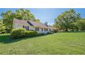 Well-maintained ranch style home with a large lawn and mature landscaping, exuding curb appeal at 2492 Bermuda Dr, Loganville, GA 30052