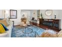 Comfortable living room with a decorative fireplace and plush seating, ideal for relaxing and entertaining at 3701 Essex Ave # 2, Atlanta, GA 30339
