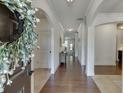 Inviting foyer with hardwood floors, arched doorways, and elegant decor at 2906 Jones Phillips Rd, Dacula, GA 30019