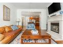 Comfortable living room with a fireplace and open layout to the kitchen at 825 Highland Ne Ln # 1116, Atlanta, GA 30306