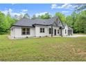 Stylish single-story home with white siding, dark trim, and a well-maintained yard at 110 Beaver Pointe, Villa Rica, GA 30180