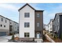 Charming two-story home with a modern design, light gray siding, and a well-manicured front yard at 3316 Stillwood Ln, Atlanta, GA 30354