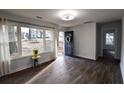 Inviting living room featuring large windows, stylish hardwood flooring, and a view of the front yard at 3601 Orchard Cir, Decatur, GA 30032