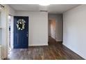 Bright living room with new hardwood flooring and a stylish front door with a wreath at 3601 Orchard Cir, Decatur, GA 30032