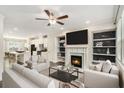 Spacious living room featuring a fireplace, built-in shelving, and comfortable seating arrangement at 1624 Venture Point Way, Decatur, GA 30032