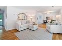 Bright living room with hardwood floors, neutral decor, and ample natural light at 3521 Eaglerock Dr, Atlanta, GA 30340