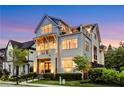 Attractive three-story home features a balcony on the second floor and a rooftop terrace for outdoor living at 4550 Lois Se St, Smyrna, GA 30080