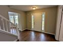 Welcoming front entrance boasting natural light and hardwood floors at 6231 Waterton Way, Lithonia, GA 30058