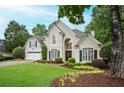 Attractive home with a well-manicured lawn and lovely landscaping, providing great curb appeal at 725 Heathland Dr, Roswell, GA 30075