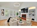 Cozy living room features a fireplace, built-in shelves, and ample natural light at 229 Brookview Pl, Woodstock, GA 30188