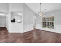 Bright dining room with hardwood floors, chair rail, and chandelier at 3020 Meadow Glen Pass, Fairburn, GA 30213