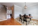 Charming dining room with hardwood floors, wainscoting, and stylish light fixture at 359 Alderwood Ln, Atlanta, GA 30328