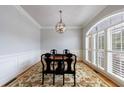 Elegant dining room features hardwood floors, large window, and stylish light fixture at 359 Alderwood Ln, Atlanta, GA 30328