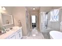 Bright bathroom offers a stylish walk-in shower and separate tub at 3740 Duckcove Way, Cumming, GA 30041