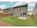 Spacious backyard with lush green grass and a patio for outdoor entertaining at 4630 Roseman Trl, Cumming, GA 30040