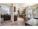 Cozy dining area adjacent to the kitchen, featuring a round table and sliding glass door at 161 Aaron Ct, Riverdale, GA 30274
