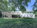 Spacious backyard featuring a wooden deck and ample green space at 3163 Old 41 Nw Hwy, Kennesaw, GA 30144
