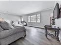 Bright living room with neutral tones, modern floors, and ample natural light at 3163 Old 41 Nw Hwy, Kennesaw, GA 30144