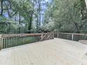 Large wooden deck featuring wooden railing, and space for outdoor seating at 3163 Old 41 Nw Hwy, Kennesaw, GA 30144