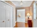 Inviting foyer with hardwood floors, closet, and elegant lighting, showcasing a glimpse into the living space at 3999 Saint Clair Ne Ct, Brookhaven, GA 30319