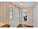 Inviting foyer with hardwood floors, closet, and a view of the living space, offering a warm welcome at 3999 Saint Clair Ne Ct, Brookhaven, GA 30319