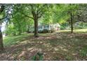 Quaint home on a lush lot with mature trees and a covered front porch at 191 White Oak Church Rd, Dallas, GA 30157