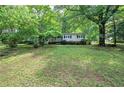 Scenic home featuring a lush, green lawn and an inviting covered porch at 191 White Oak Church Rd, Dallas, GA 30157