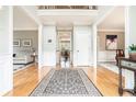Welcoming foyer with gleaming hardwood floors and neutral paint at 2258 Bright Water Dr, Snellville, GA 30078