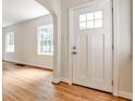 Bright entryway boasting hardwood floors, a white front door, and an arched doorway at 1986 N Decatur Ne Rd, Atlanta, GA 30307