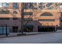Attractive brick apartment building features a street view with parking garage and building entrance at 115 W Peachtree Nw Pl # 713, Atlanta, GA 30313