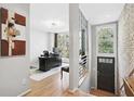 Bright and airy office space with large window, modern decor, and hardwood floors at 1323 Peachtree Ne Vw, Atlanta, GA 30319