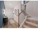 Stylish entryway with modern accents, a staircase, and a decorative console table at 7 Camellia Dr, Fairburn, GA 30213
