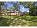 Spacious backyard with a deck, providing a perfect outdoor living space at 1111 Louise Se Ct, Conyers, GA 30013