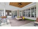Spacious covered patio includes an outdoor kitchen and ample seating for relaxing or entertaining at 4216 Tattnall Run, Acworth, GA 30101